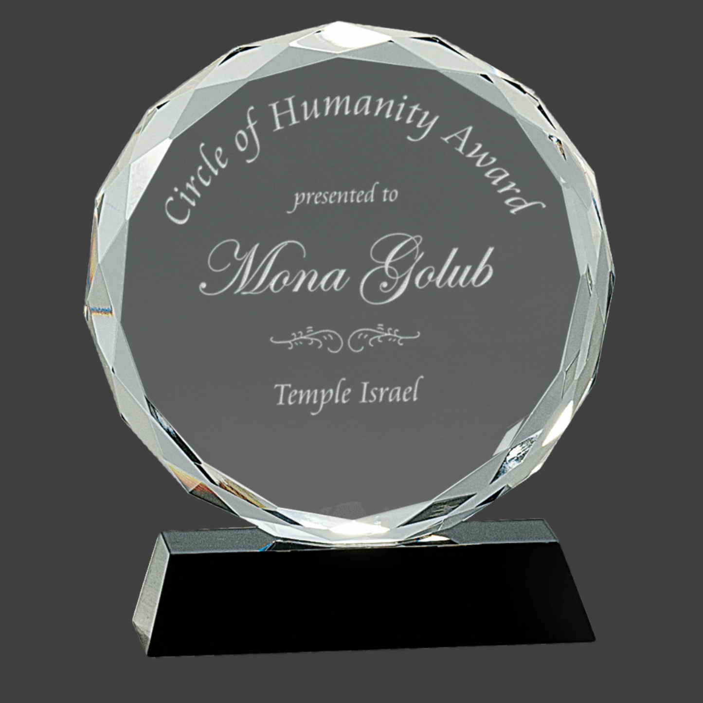 Round Facet Crystal On Black Pedestal Base